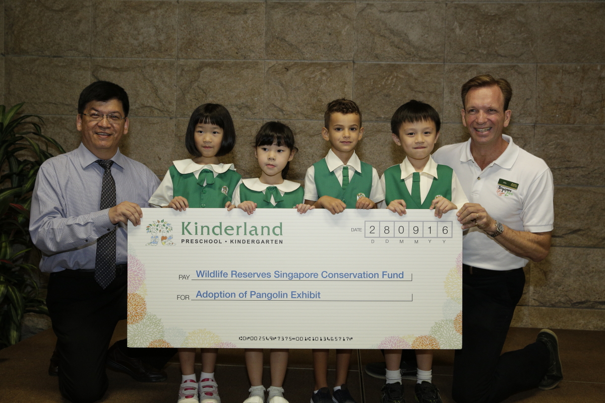 Our Little Pangolin Ambassadors at the Cheque Presentation Ceremony with Mr Seet Lee Kiang, General Manager of Kinderland International Education and Mr Mike Barclay, CEO of Wildlife Reserves Singapore.